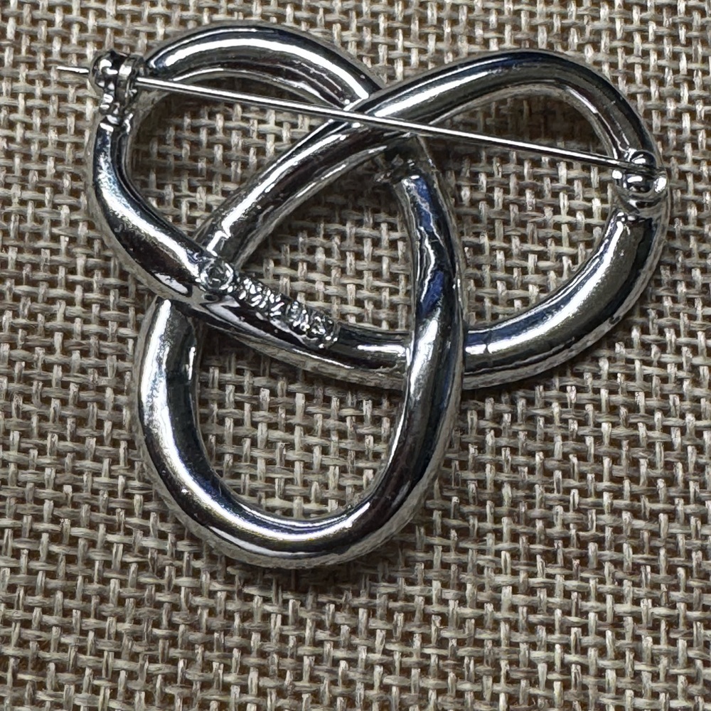 Silver Interlocking Brooch With Sparkling Stones - image 2